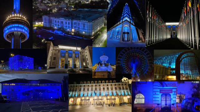Collage of various global landmarks illuminated with blue light at night, including towers, buildings, and fountains.