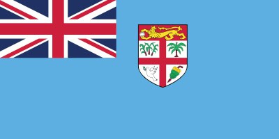 The image shows the flag of Fiji, featuring a Union Jack in the top left corner and a shield with multiple symbols on a light blue background.