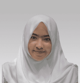 Young person wearing a white hijab, smiling slightly, against a gray background.