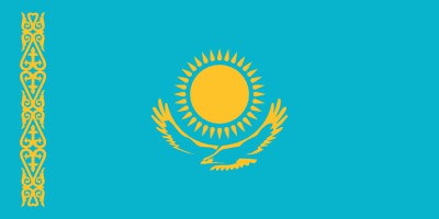 Flag of Kazakhstan, featuring a gold sun with 32 rays above a golden steppe eagle on a blue field. A national ornamental pattern is on the left.