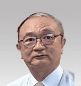 An older man wearing glasses and a white shirt with a tie is looking forward. The background is a gray gradient.