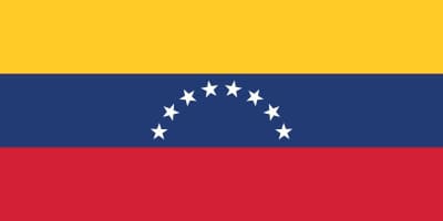 The flag of Venezuela with horizontal yellow, blue, and red stripes and eight white stars arranged in an arc on the blue stripe.